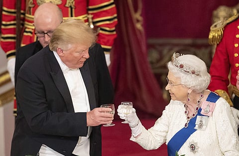 US President Donald Trump, left and Queen Elizabeth II toast, during the State Banquet at Buckingham Palace, in London. (Photo | AP)