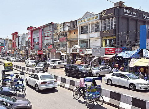 Snarls near the Lajpat Nagar Market are largely blamed on vehicle owners who park randomly on the road, leaving little or no space for commuters to pass (Photo | Praveen Negi)