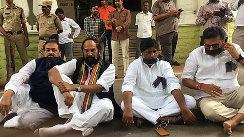 Congress MLAs staging protest at Assembly Gandhi Statue Entrance against TRS. (Photo | Special Arrangement)