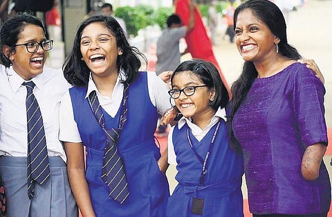 Quadruple amputeee Shalini Saraswathi with schoolchildren at the launch of Mercy Drops, a new initiative seeking community participation in healthcare Pandarinath B