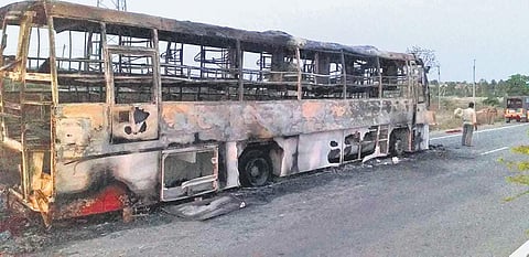 A private travels bus that was reduced to a skeleton in a fire mishap, near Enugumarri, in Kurnool district on Thursday | Express