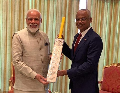 Modi gifted a cricket bat to Solih signed by the Indian cricket team after holding bilateral talks. (Twitter Photo)