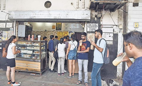 Customers sip milk shakes right outside the popular ‘Keventers’ outlet at Connaught Place in New Delhi on Friday | Parveen NEGI