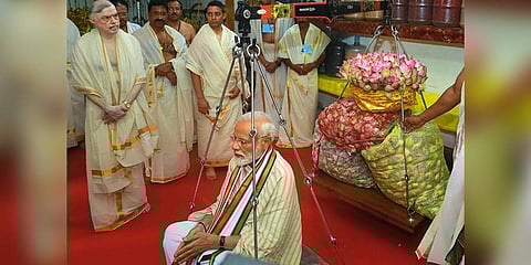 Prime Minister Narendra Modi weighed against lotus flowers as he offers his prayers at Lord Krishna temple in Guruvayur of Thrissur, Kerala on June 8 2019.(Photo | PTI)