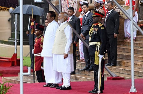 Prime Minister Narendra Modi (C) and Sri Lankan President Maithripala Sirisena (L) attend a welcoming ceremony for Modi at the Presidential Secretariat, in Colombo. (Photo | AFP)