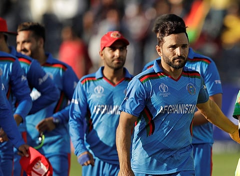 Afghanistan skipper Gulbadin Naib with his teammates (Photo | AP)