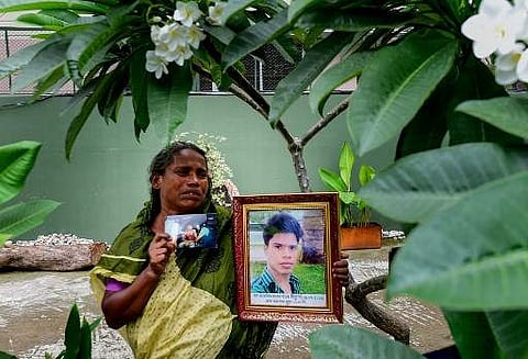 A mother pays tribute to her son, victim of the Holey Artisan Bakery cafe siege to commemorate the third anniversary of the attack carried out by Islamist militants. (Photo| AFP)