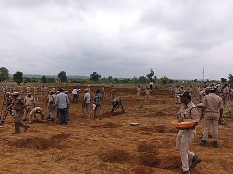Forest officials conducting afforestation drive. (Photo | EPS)