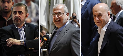 from left, Wafiq Safa, a top Hezbollah security official, and Lebanon Parliament members Muhammad Hasan Ra'd and Amin Sherri in Beirut. | AP
