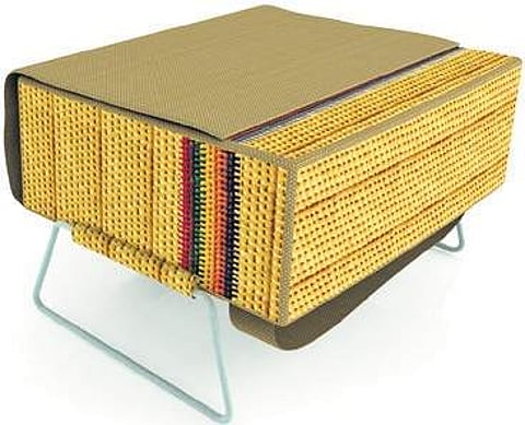 Student designs bag-cum-desk from grass to help schoolchildren