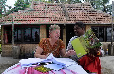 Kathleen Marie Huolohan being helped by K B Rajeev with Malayalam lessons. (Photo | A Sanesh, EPS)