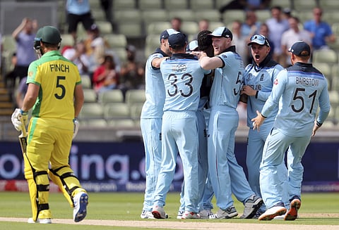 Aaron Finch departs as England players celebrate. (Photo | AP)