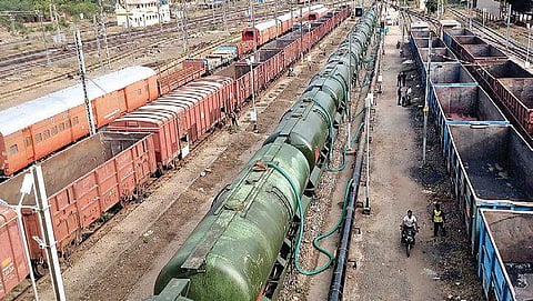 Wagons getting filled with water at Jolarpet railway yard on Thursday. (Photo | S Dinesh, EPS)
