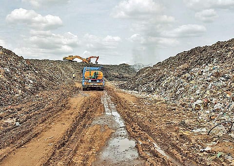 In order to prevent spread of fire at Ariyamangalam dump yard, water tankers were deployed to keep heaps of garbage wet on Saturday | M K Ashok Kumar