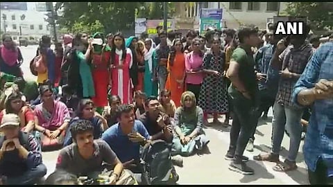 Students of University College protested outside the college after a 3rd year student got stabbed in a clash that broke out between the members of SFI and other students of the college. (Photo | ANI Twitter)
