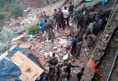 Rescue works underway after a building collapsed at Kumarhatti-Nahan road in Solan Sunday July 14 2019. | PTI