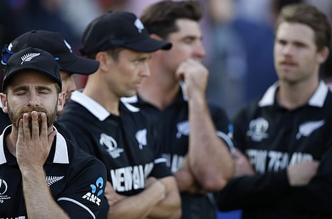 New Zealand's captain Kane Williamson, left, reacts as he waits for the trophy presentation after losing the Cricket World Cup final match between England and New Zealand. (Photo | AP)