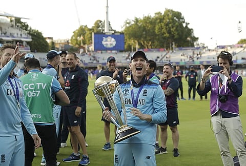England's captain Eoin Morgan holds the trophy after winning the Cricket World Cup final. (Photo | AP)