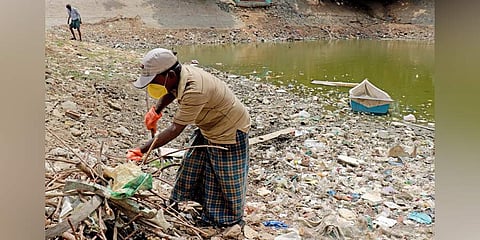 Mari cleaning up Peeliamman temple tank in Taramani. (Photo | T Raja Rajan, EPS)
