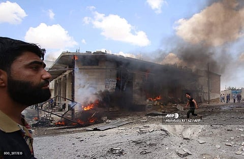 Syrian civilians react following an airstrike by Syrian regime forces in Maar Shurin on the outskirts of Maaret al-Numan in northwest Syria on July 16, 2019 (Photo | AFP)