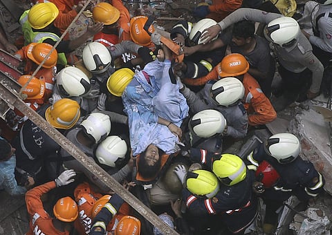 Rescuers carry out a survivor from the site of a building that collapsed in Mumbai, India, Tuesday, July 16, 2019. (Photo | AP)