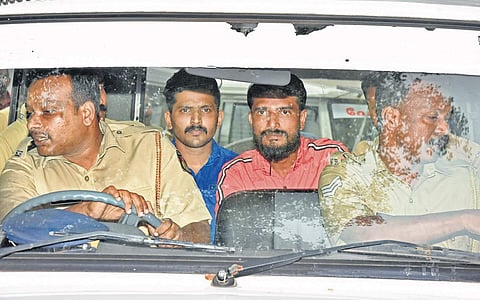 Sivarenjith (second left) and Naseem (second right), the first two accused in the murder attempt on Akhil Chandran at University College in Thiruvananthapuram, being taken to the court by the Cantonment police | B P Deepu