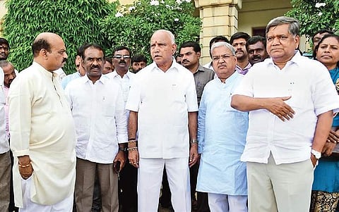 BJP state president B S Yeddyurappa with party leaders in Bengaluru on Monday