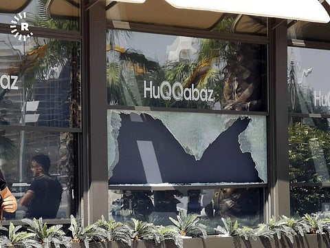 Broken glass shows in the window of a restaurant that was the scene of a shooting in Irbil, Iraq (Photo | AP)