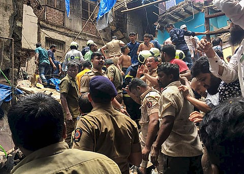 Mumbai Police personnel and rescue teams at the site after a four-storey building collapsed at Dongri in Mumbai Tuesday July 16 2019. | pti