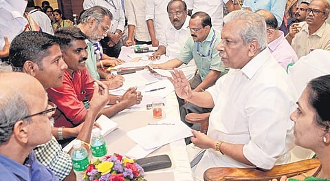 Minister for Local Self Government A C Moideen attending a file adalat at Town hall in Kochi.