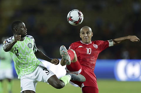 Tunisia's Wahbi Khazri and Nigeria's Jamilu Collins fight for the ball during the African Cup of Nations third place soccer match between Nigeria and Tunisia in Al Salam stadium in Cairo. (Photo | AP)