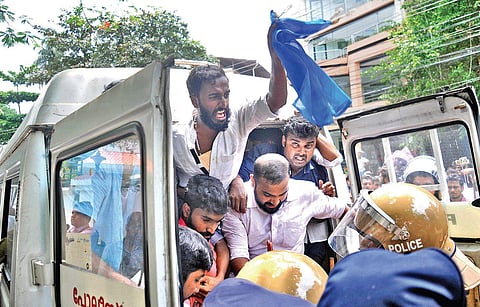 Police removing KSU activists who staged protest in front of District Collector’s camp office on Monday demanding the arrest of all accused involved in the murder of SFI leader M Abhimanyu at Maharaja’s College | A Sanesh