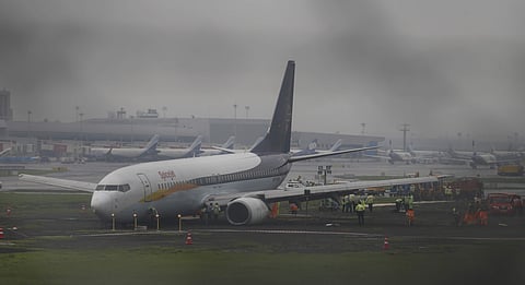 A domestic flight that skidded off the main runway late Monday night during heavy monsoon rains is seen at the Mumbai airport. (Photo | AP)
