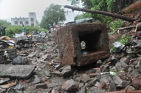 Rescue team at the site where a wall of Singhad Institute collapsed on the makeshift shelters of labourers at Ambegaon area in Pune on 2 July 2019. (Photo | PTI)