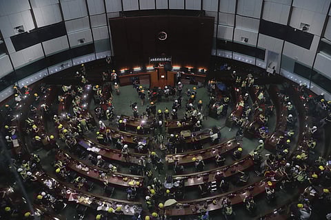 Protesters gather inside the meeting hall of the Legislative Council in Hong Kong | AP