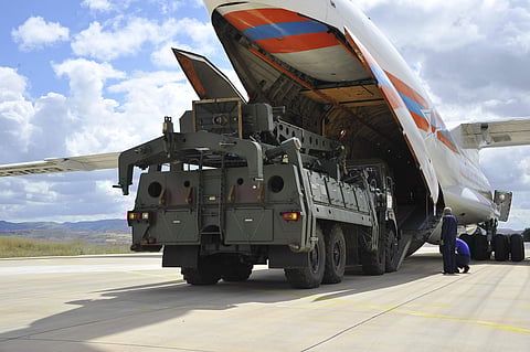 Military vehicles and equipment, parts of the S-400 air defense systems, are unloaded from a Russian transport aircraft, at Murted military airport in Ankara, Turkey. For representational purposes. ( Photo |AP)
