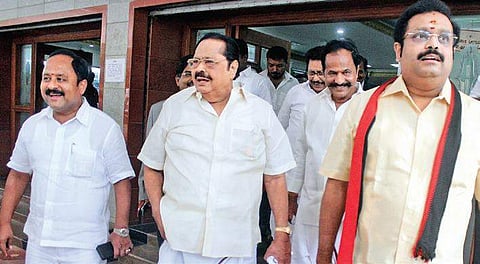 DMK treasurer Durai Murugan and his son DM Kathir Anand emerging from collectorate after scrutiny of nominations, in Vellore on Friday | dinesh S