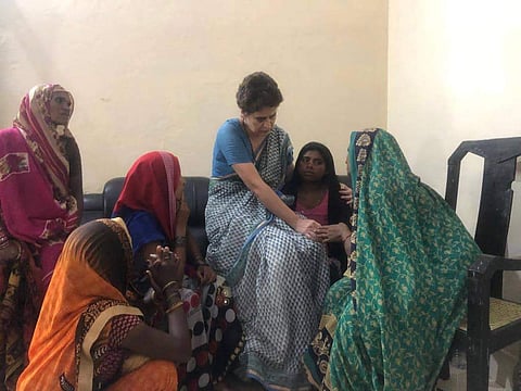 Congress General Secretary Priyanka Gandhi Vadra consoles a family member of a Sonbhadra massacre victim who had travelled to Chunar Fort to meet her after the former was stopped from proceeding to Sonbhadra in Mirzapur on 20 July 2019. (Photo | AICC)