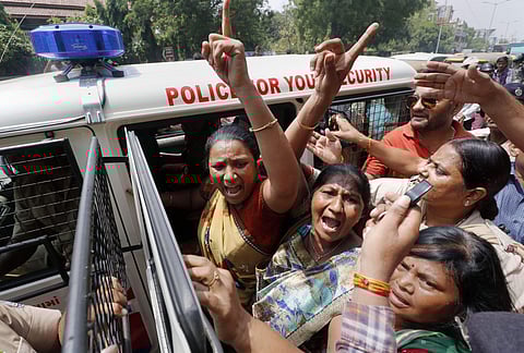 Ahmedabad Police detain supporters of Congress party during protest. (Photo| PTI)