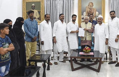 A farmers delegation from Rampur hands over a memorandum to Uttar Pradesh Governor Ram Naik against Samajwadi Party leader and MP Azam Khan at Raj Bhavan in Lucknow Sunday July 21 2019. | PTI
