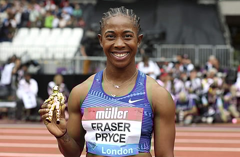 Jamaica's Shelly-Ann Fraser-Pryce reacts after taking gold in the Women's 100m final | AP