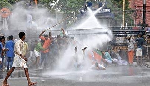 Police use water cannons to disperse Yuvamorcha activists demanding the ouster of college principal and action against culprits in stab case, in front of University College on Monday B P Deepu