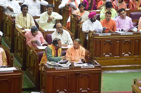 Uttar Pradesh Chief Minister Yogi Aditiyanath and Parliamentary Affairs Minister Suresh Khanna at the UP Assembly session. (Photo| PTI)