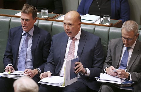 Home Affairs Minister Peter Dutton, center, interjects during debate in Australia's Parliament House in Canberra. (Photo | AP)