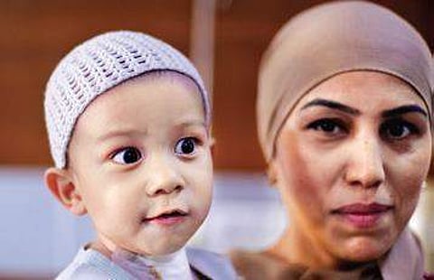 Muhammadjon Hakimov with his mother