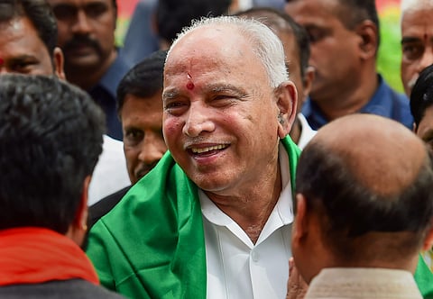 BJP leader B S Yeddyurappa his during swearing in ceremony as Karnataka Chief Minister at Raj Bhavan in Bengaluru Friday July 26 2019. | PTI