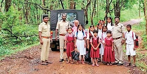 Children, along with forest officials, on their way to school in Belagavi | Express