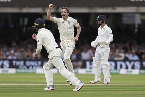 England's Chris Woakes celebrates taking his fifth wicket during the third day of the test match against Ireland (Photo | AP)