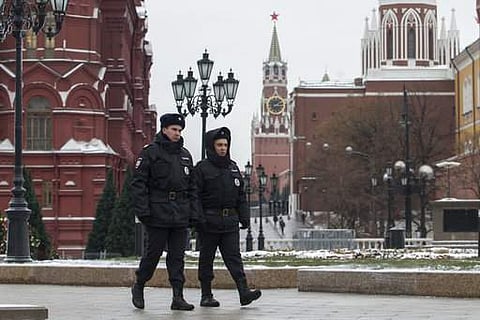 Russian police officers patrol the Manezh Square at the Kremlin in Moscow. | AP