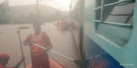NDRF rescue operations underway after Mahalaxmi Express got stranded on waterlogged tracks after heavy overnight rains in Mumbai on 27 July 2019. (Photo | Indian Navy Twitter)